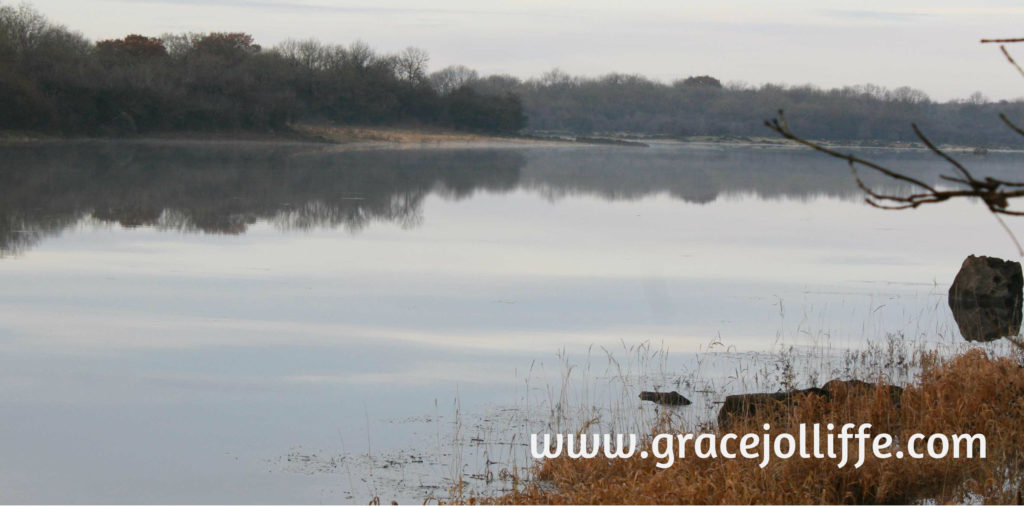 sky reflected in lake illustrating article about How to reconnect your children with nature