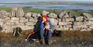 Grace Jolliffe with her small dog on the Green Road, Clare - illustrating and article about Acceptable Racist Abuse in Ireland