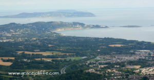 view from top of Sugarloaf across Bray to Howth illustrating a post about walking Sugarloaf