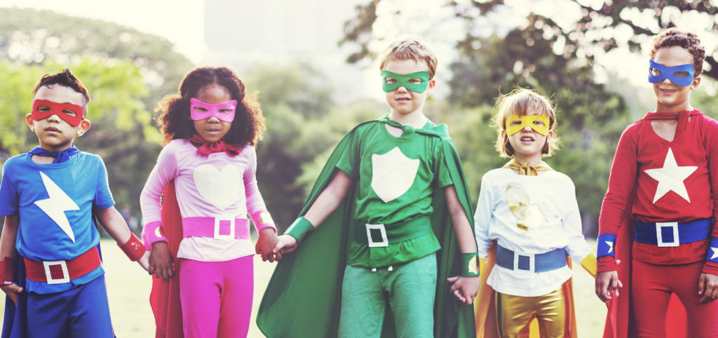 group of kids in superhero outfits illustrating an article called Gender Neutral - Change and Challenge